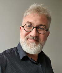 picture of Serge Pinto, white man with rounded glasses and white beard